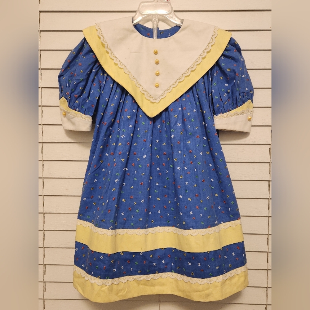 Vintage Homemade Blue and Yellow Alphabet Dress with Lace Trim. Size 7/8?